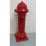 Cast Iron Road Side Water Pump, with a central mask of a lion, painted red, 95cm high