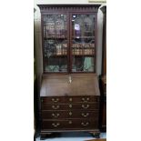 Late 19th C mahogany Bureau Bookcase, a Greek dental cornice over 2 glazed upper doors enclosing 3
