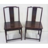Matching pair of Chinese Side Chairs, with shaped central slats, carved with dragons, dovetail