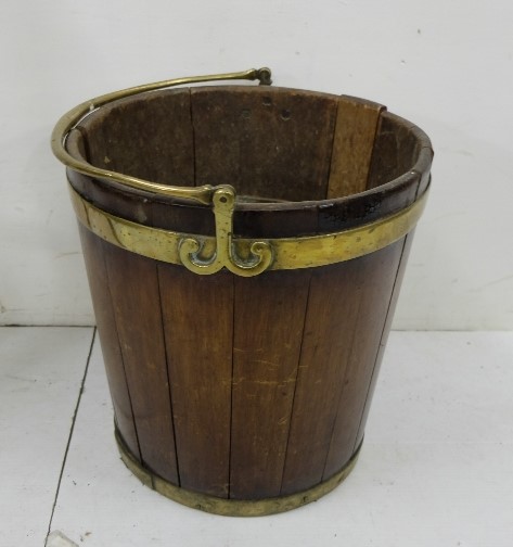 Georgian mahogany Turf Bucket, circular, with brass banding and pivoting brass handle (later