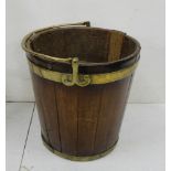 Georgian mahogany Turf Bucket, circular, with brass banding and pivoting brass handle (later