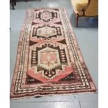 Long Persian Wool Floor Runner – brown and pink ground with central patterns, signed at the