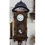 Victorian Walnut and Ebonised Vienna Wall Clock, the enamel dial with Roman numerals with a two