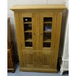 Reproduction light oak Side Cabinet with two glazed bevelled glass doors above two cupboard doors,