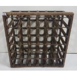 Pine Framed Wine Bottle Rack, in a cast iron frame, (for 36 bottles) 27” x 27”