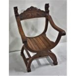 Oak “Throne” Armchair with lion mask finials, with carved panel on C shaped base and carved