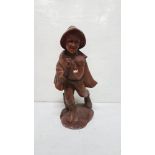 Carved figure of a happy striding Musician, on an oval base, 31”h