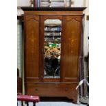 Mahogany wardrobe, the single door framing a mirror, 50”w x 78”h