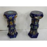 Matching pair of early 20th C deep blue glazed terracotta jardinière stands with floral fretwork,