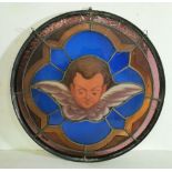 Italian Stained Glass circular Window Pane, figure of winged Putti, surrounded by blue and gold