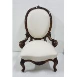 Victorian mahogany framed Nursing Chair on carved cabriole legs, cream linen covered back and seat