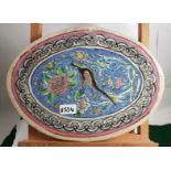 Antique Italian pottery oval glazed painted Tile, decorated with central bird surrounded by flowers,