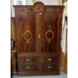 Edwardian flame mahogany Wardrobe, the arched and moulded top over a floral spray and chequer line