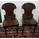 Matching Pair of Georgian Mahogany Hall Chairs with reeded and fan shaped backs, on turned front