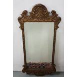 “Queen Anne” craved gilt wood framed Wall Mirror, foliage detail, 86cm h x 41cm (framed by Bregazzi