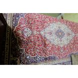 Red Ground Kashmir Carpet with a traditional medallion design, 3m x 2m