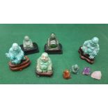 Collection of miniature laughing Buddha Figurines, mainly green, possibly jade etc, some on stands,
