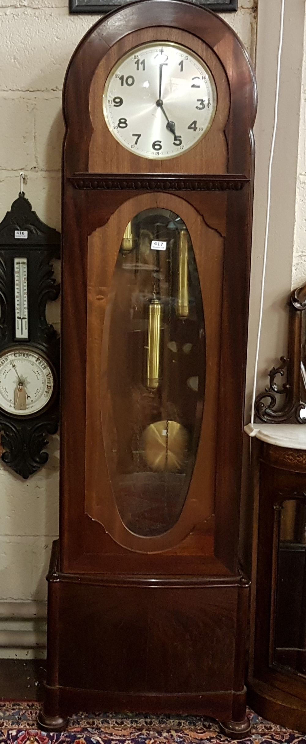 Early 20th century mahogany longcase clock with oval bevelled glass door, the circular silvered