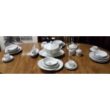 A modern Limoges Porcelain 12 place Dinner Service, with silvered borders and silvered