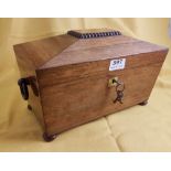 A 19th century rosewood tea caddy with wooden ring handles, on bun feet, 12 ½" wide