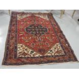 Wool Floor Rug, central medallion, red ground, 1.9m x 1.35m