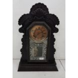 American Ansonia Mantle Clock, in a carved walnut case (dial face damaged), with key, 58cm h