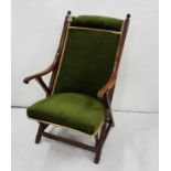 Mahogany framed Armchair, green velour fabric, X framed side arms