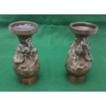 Pair of small heavy bronze bulbous vases with raised Japanese dragon detail, 16cm high (2)
