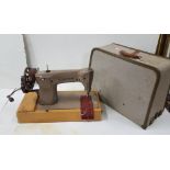 Hand operated Singer Sewing Machine, model 201k, with original canvas backed case