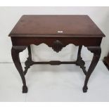 Irish Mahogany Silver Table, the moulded top over central shell designs to the front and back