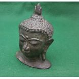 Metal figurine of kneeling praying Buddhist monk, 13cm high and Early Bronze bust of Hindu god, 9cm