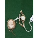 Cameo style in a 9ct oval brooch (hall marked) and Lady’s 1/10 12ct rolled gold watch, white