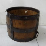 Mahogany barrel form log bin with cast iron mounts and carrying handles, 25cm h x 35cm dia