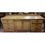 Large 19th century stripped pine side cabinet with 2 centre panel doors flanked by 6 small drawers