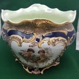 Large pottery Jardinière, bulbous shape, with frilled rim, blue ground with decorative cherub