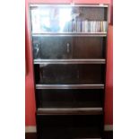 Contemporary Display Cabinet with 5 sliding glass doors with a shelf of classical subject CDs,