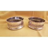 Pair of Sheffield plated wine bottle coasters, with ribbed borders, 13cm dia