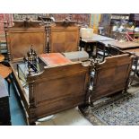 Late 19th C Continental walnut large Bedframe, each backboard mounted with carved memorial type