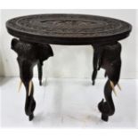 19th C Indian oval carved hardwood Occasional Table, the central panel decorated with elephants