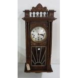 Early 20th century continental beechwood Vienna style wall clock spindle gallery above a beveled