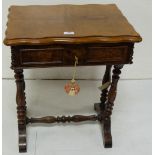 19th century continental walnut work table on twin end turned reeded supports united by a matching