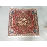 Small Persian Square Shaped Floor Mat, red ground with a central medallion, 70cm square