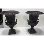 Matching pair of cast iron Garden Urns in the classic Romanesque style, painted black, 63cm h x 50cm