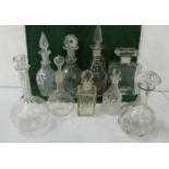 Shelf containing a quantity of various 19th C & later Cut Glass Decanters including one large