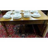 Victorian rectangular mahogany library table on turned tapering supports with brass casters, 1.38m w