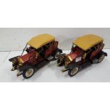 Pair of tin models of vintage cars, painted red and gold, each 35cm w x 16cm h (2)