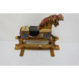 Small hand painted gliding Rocking Horse on a pine stand, 1m wide x 75cm h
