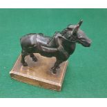 Miniature metal saddled and bridled horse on wooden stand, 10cm w x 12cm h