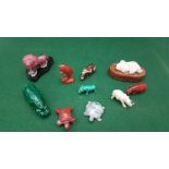 Collection of miniature exotic animal figurines, including rhinoceros, hippopotamus, lion, turtle,