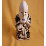 Early 20thC Stoneware Figure of a bearded Chinese Figure with child at foot, blue flowers on